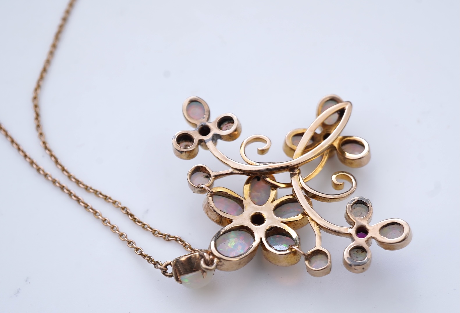 An opal and garnet pendant necklace, circa 1900